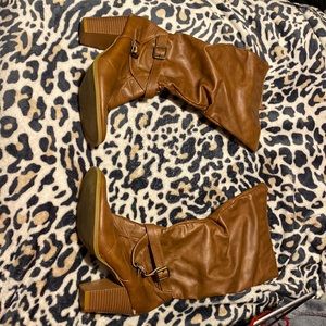Tall brown boots, size 9 in women’s.